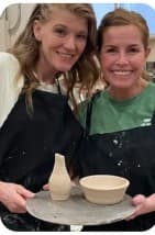 Two students with their finished pieces